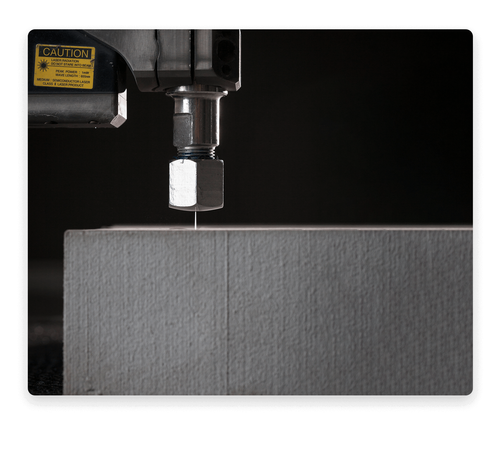 a waterjet cutting a thick block of steel